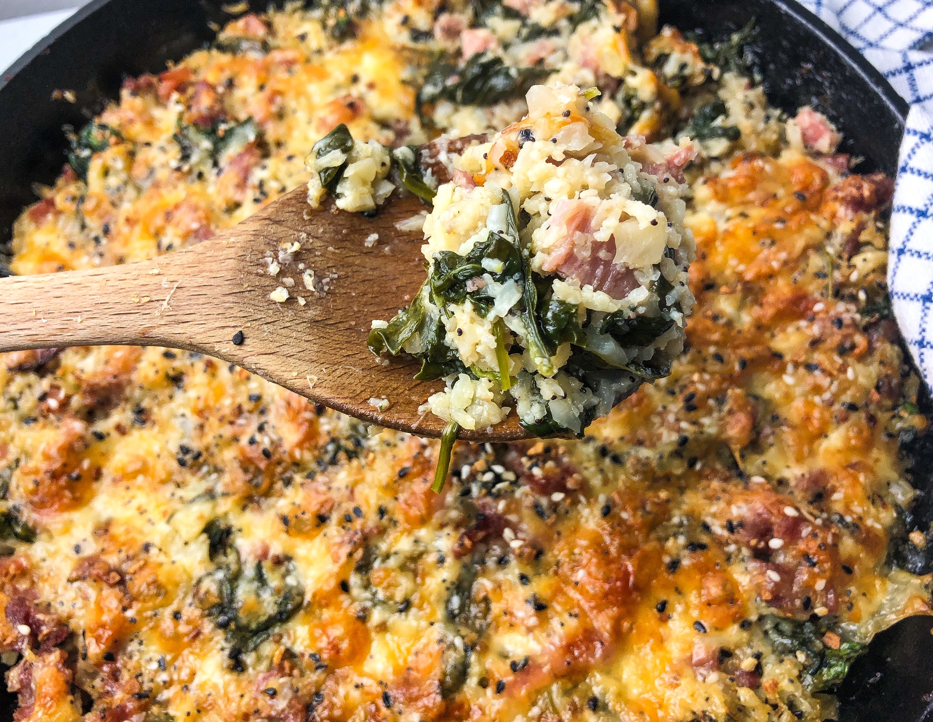 Cauliflower rice casserole with ham, cheese, spinach, and everything seasoning
