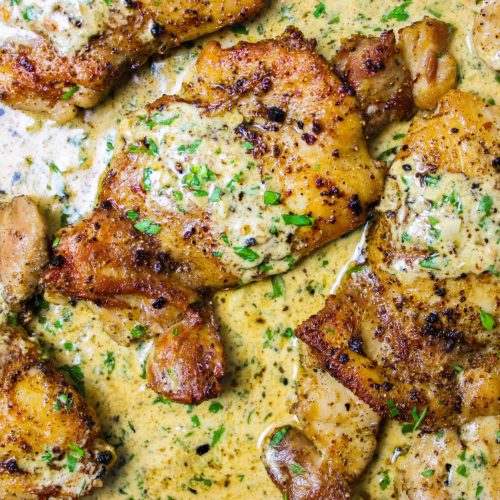 chicken thighs in a creamy herb sauce